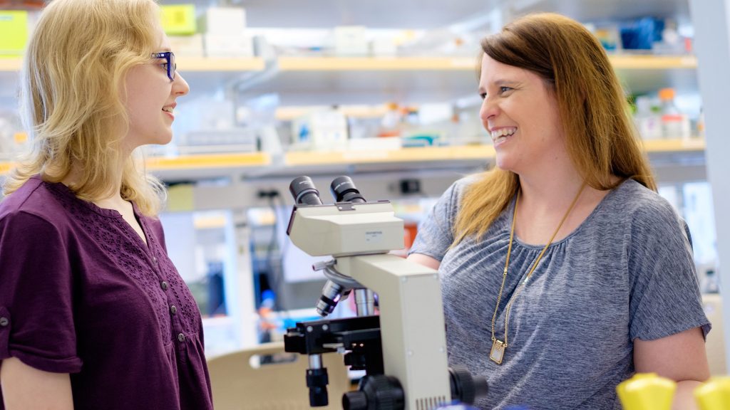 Student speaks with professor