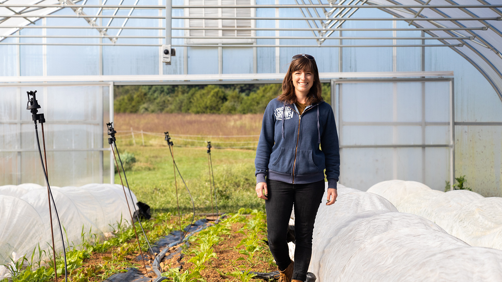 Clara Metzler walking in a greenhouse