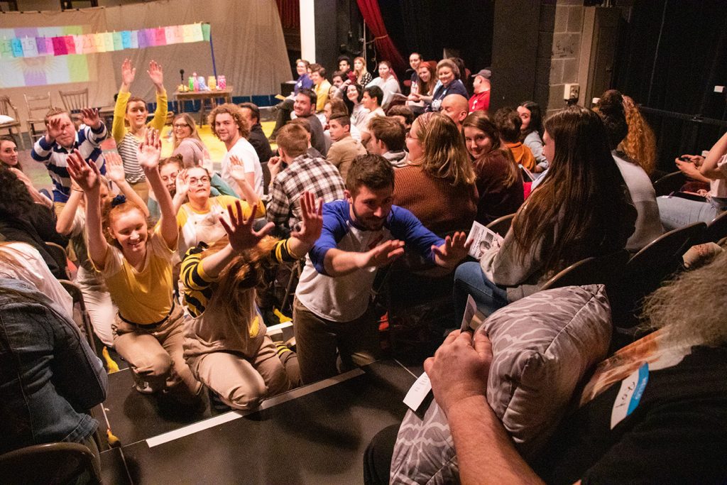 Large group of theatre students during production
