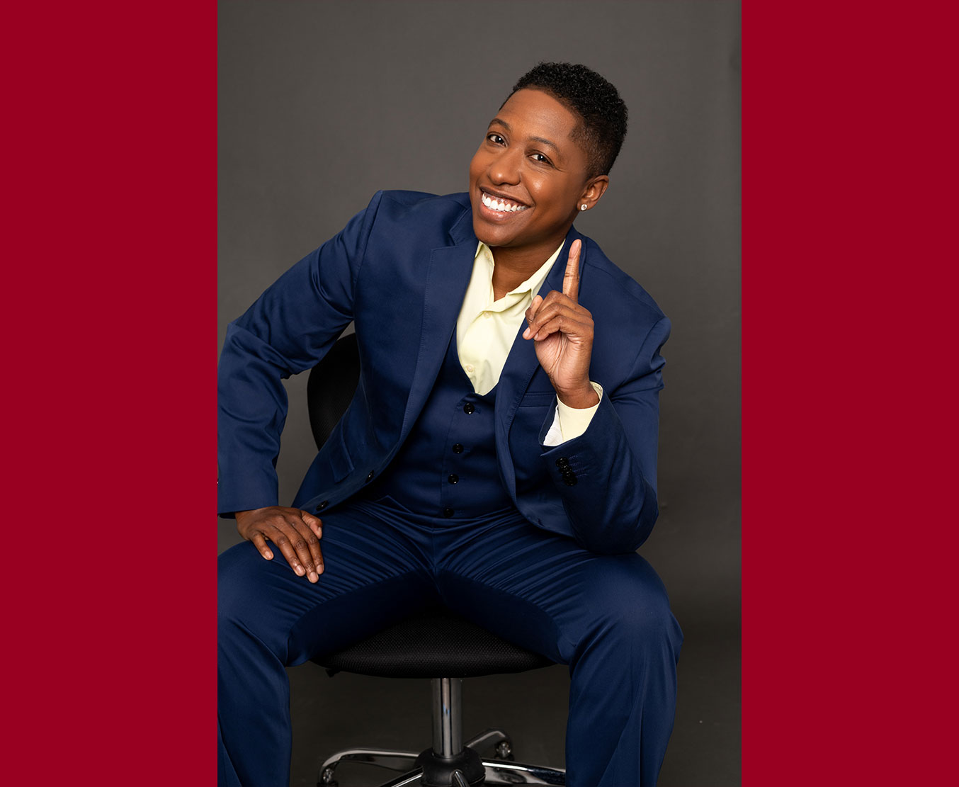 Ebone Bell pictured sitting with one finger raised