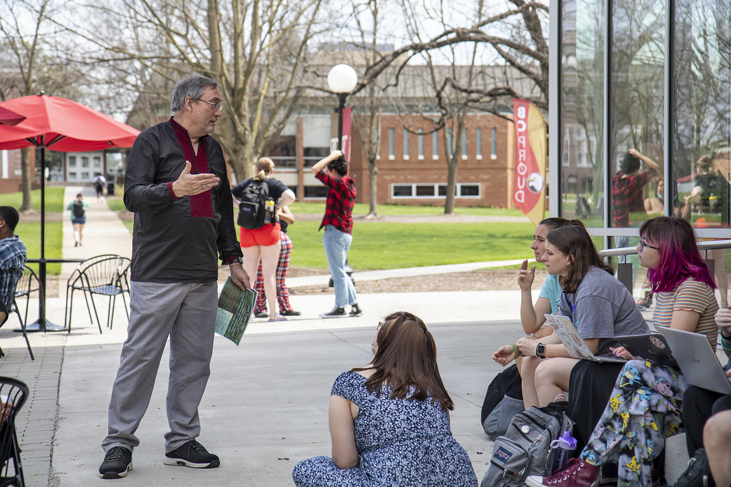 Professor teaching a class outside the F-L-C