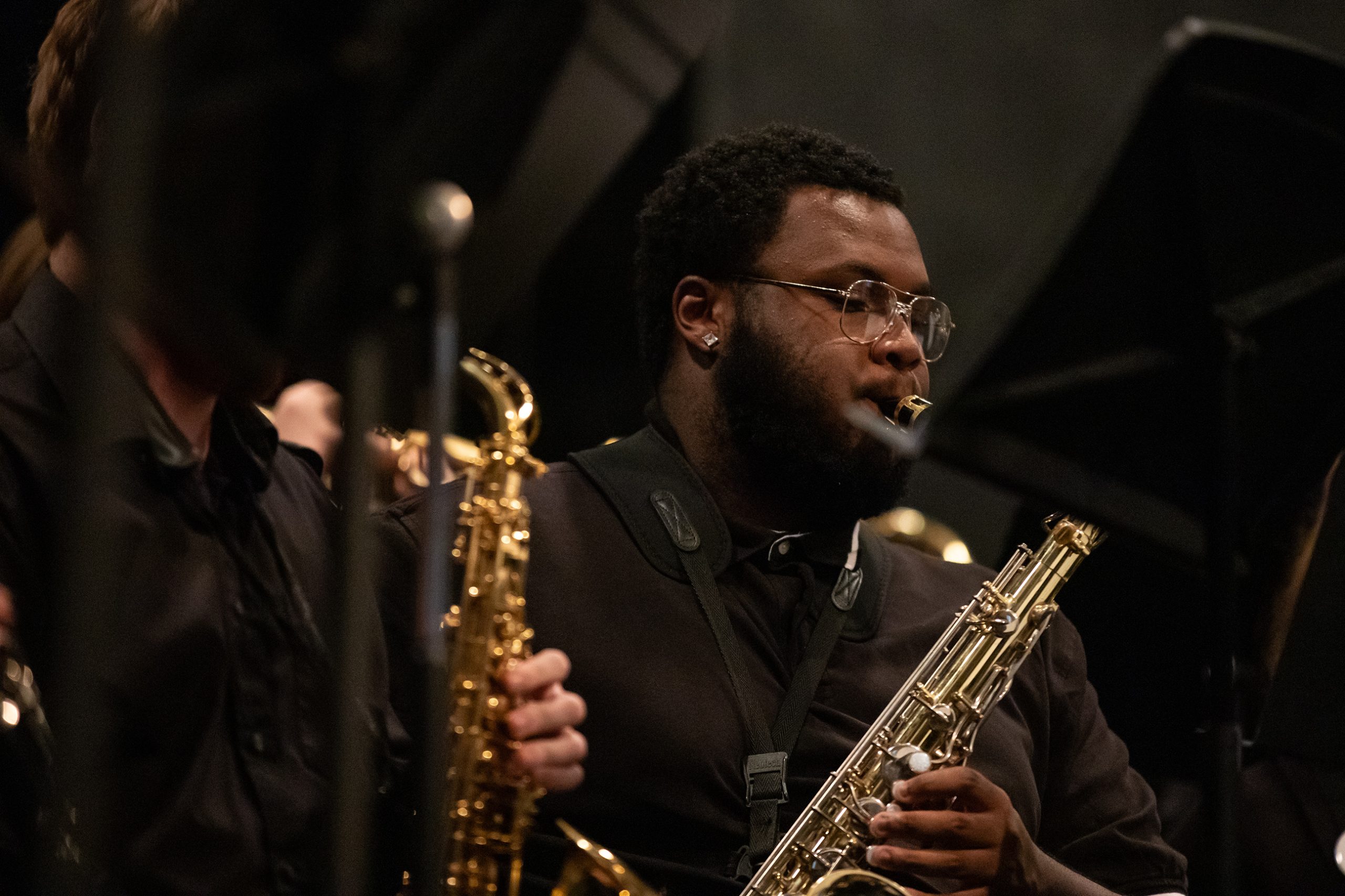 Music student playing the saxophone during a performance