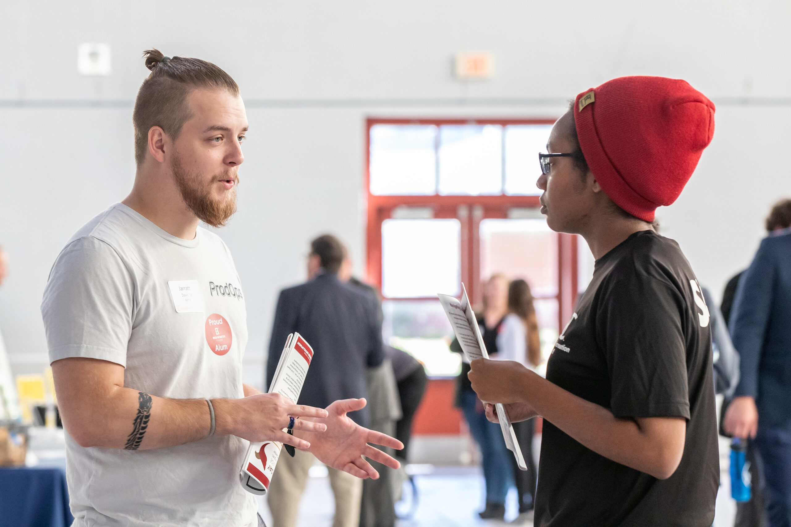 Employer speaking with student at career exploration day