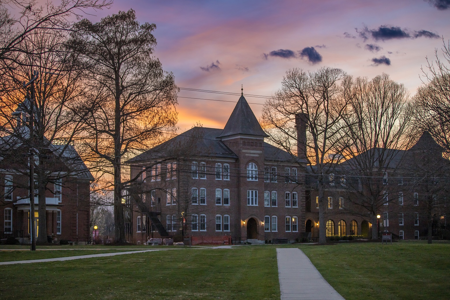 Flory Hall pictured during a purple-ish pink and orange sunset