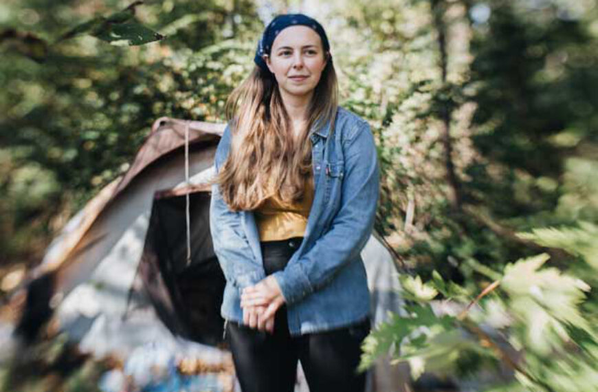 Allison Henry stands in front of a tent city in Waynesboro VA