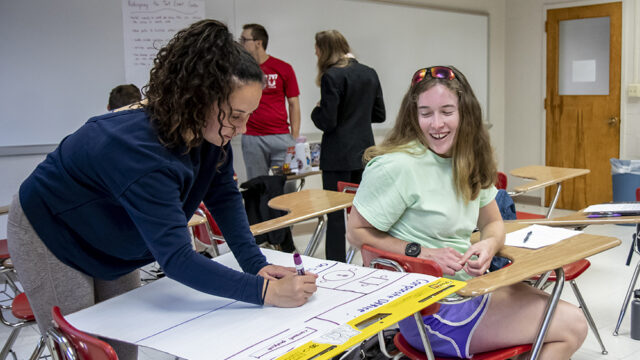 Students working together in human resources class