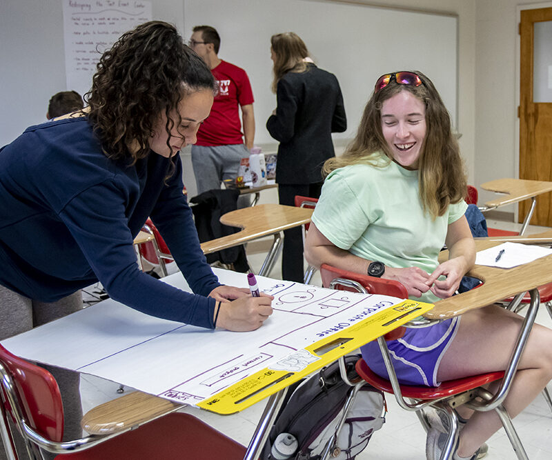 Students working together in human resources class